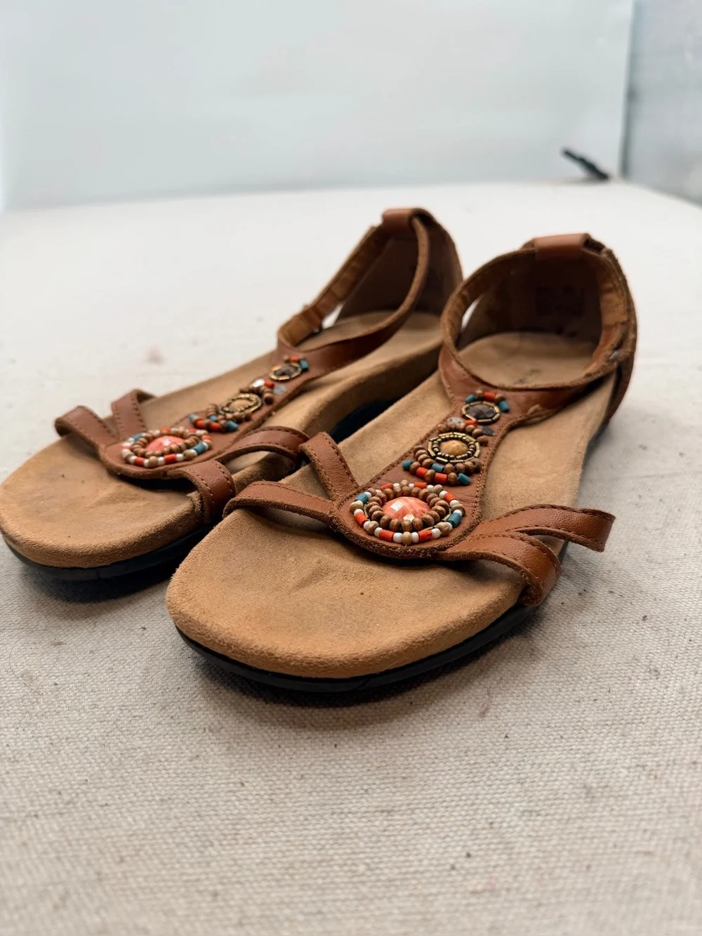 Minnetonka Women's Tan Beaded T-Strap Sandals